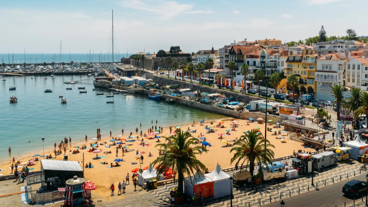 high vantage point of crowded sandy praia do ribeiro and