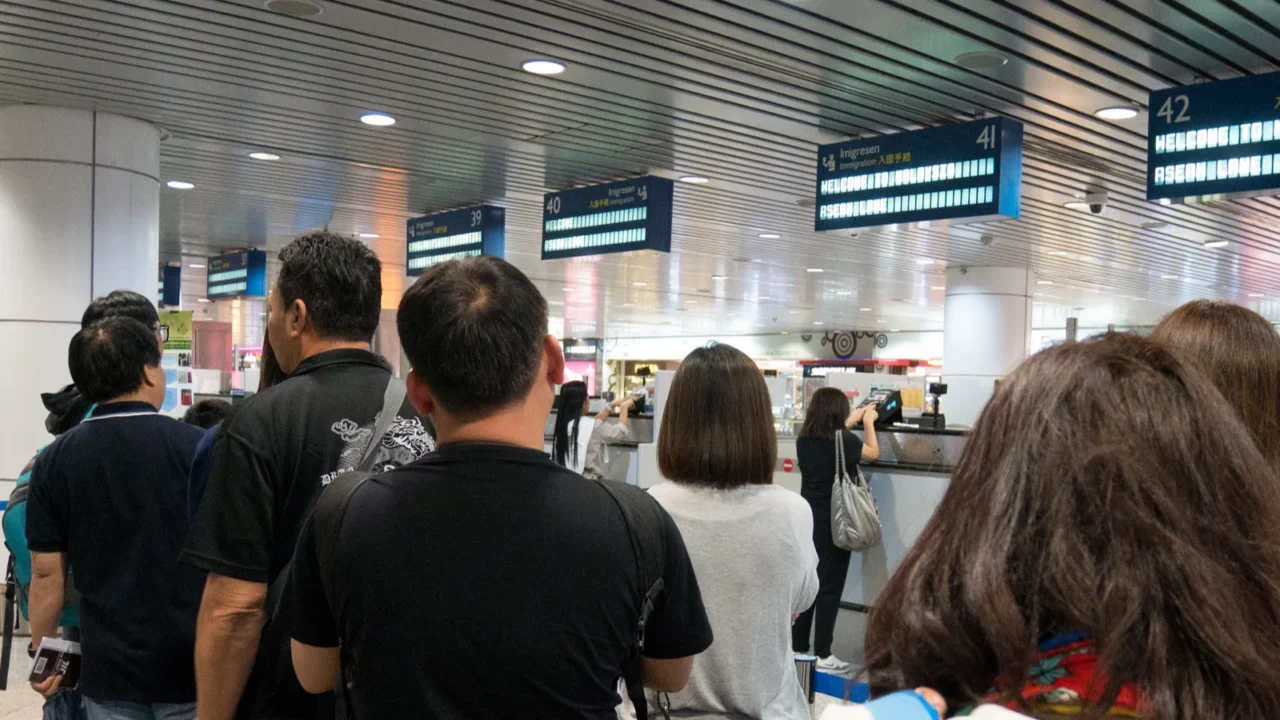 malaysia mar 21 2017 group of travelers enter immigration