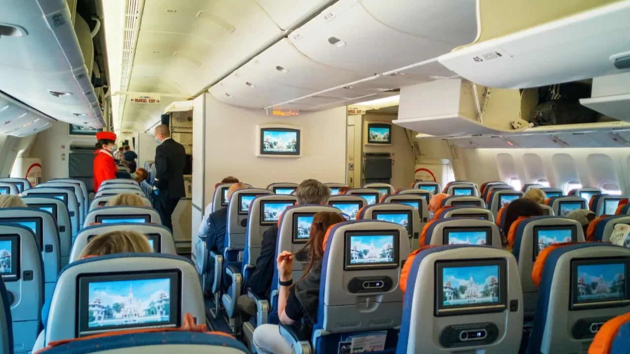 moscowrussiajune 032021aircraft cabin interiortravel passenger seat with monitor screenspeople in