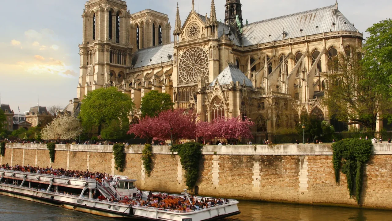 paris notre dame with boat on seine france