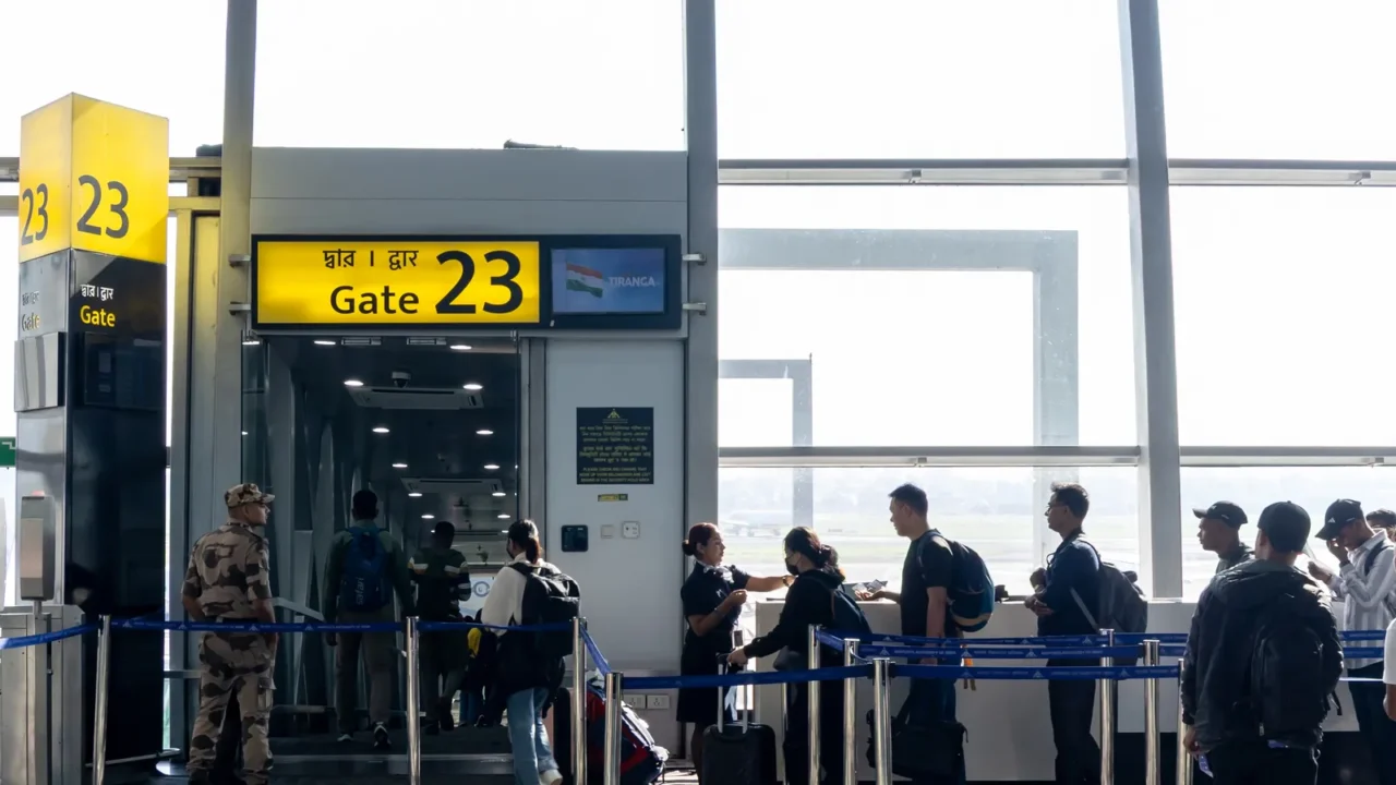 passengers waiting in queue for boarding at airport gate with