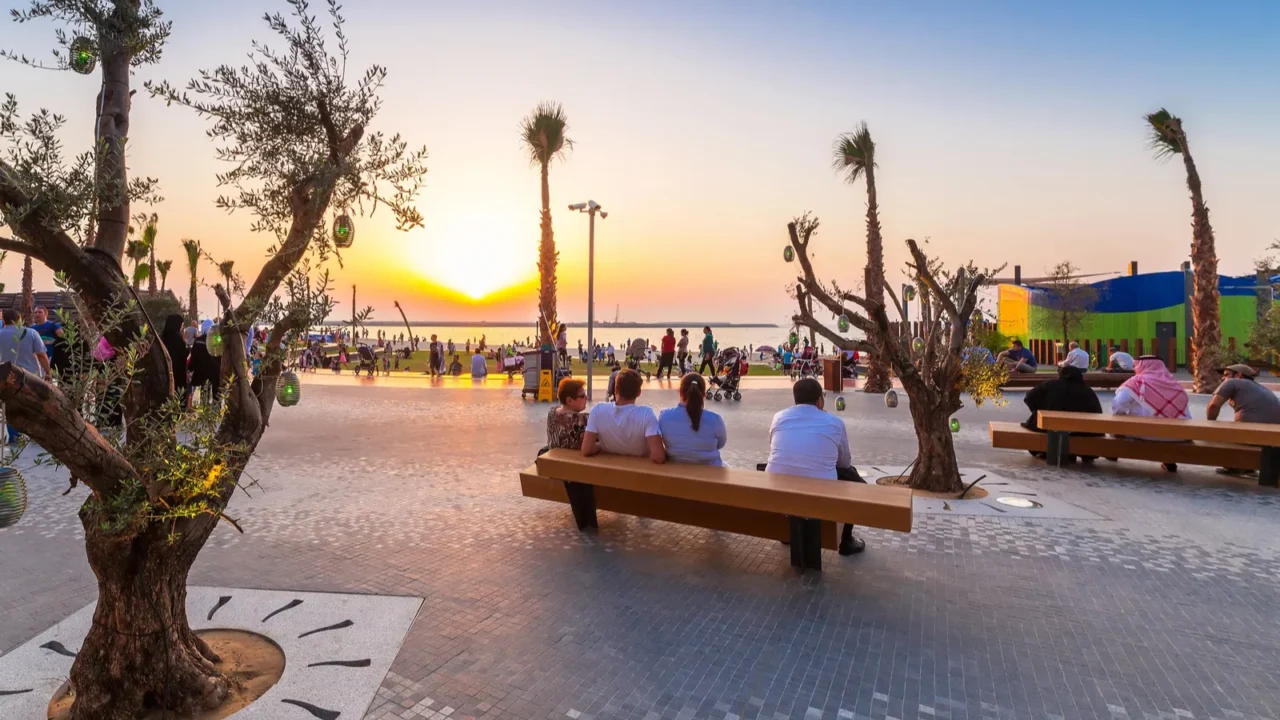 people watching sunset at dubai marina