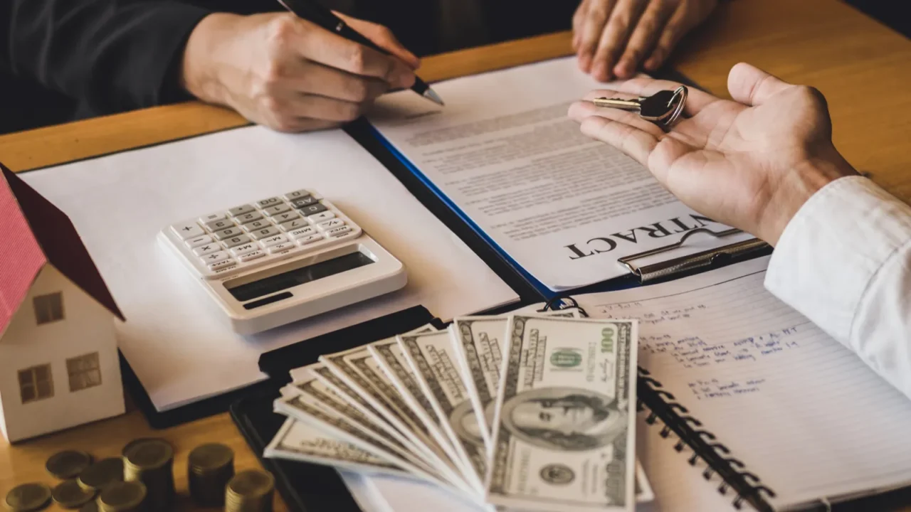 salesman house brokers provide key to new homeowners in office