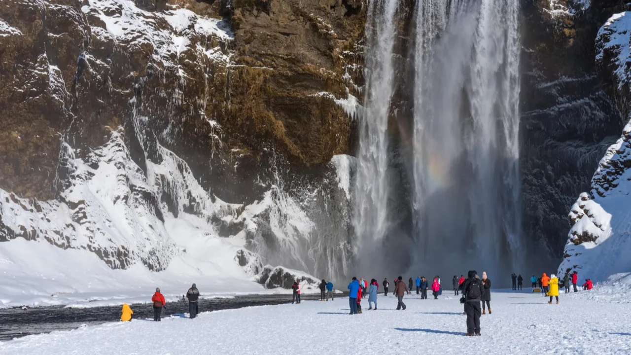 skogafossiceland  march 5 2020 tourists at skogafoss waterfall one