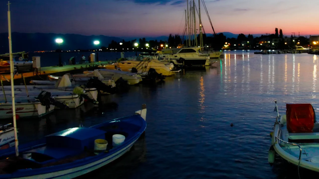 small harbor with boats at night