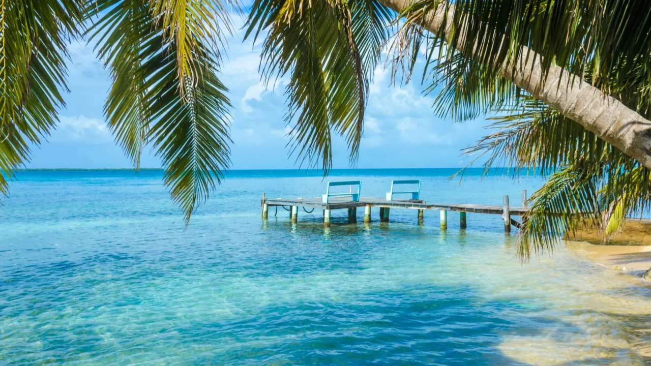 tobacco caye  wooden pier on small tropical island at