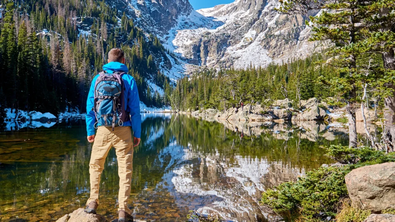 tourist near dream lake at autumn in rocky mountain national
