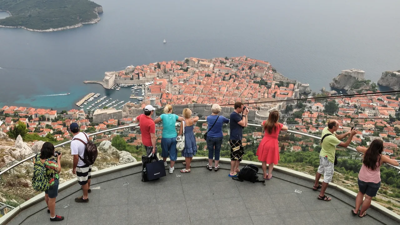 tourists looking at the old town of dubrovnik from above