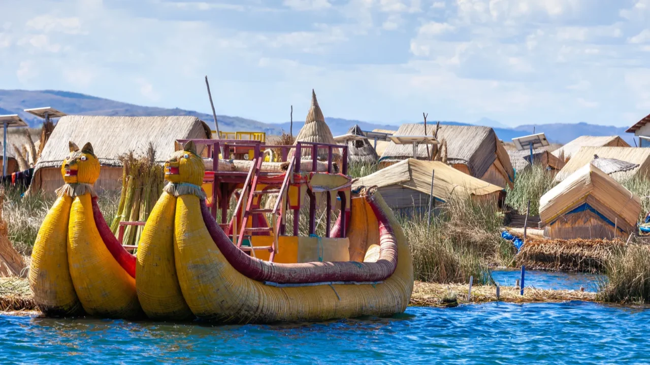 traditional reed boat as transportation for tourists floating uros islands