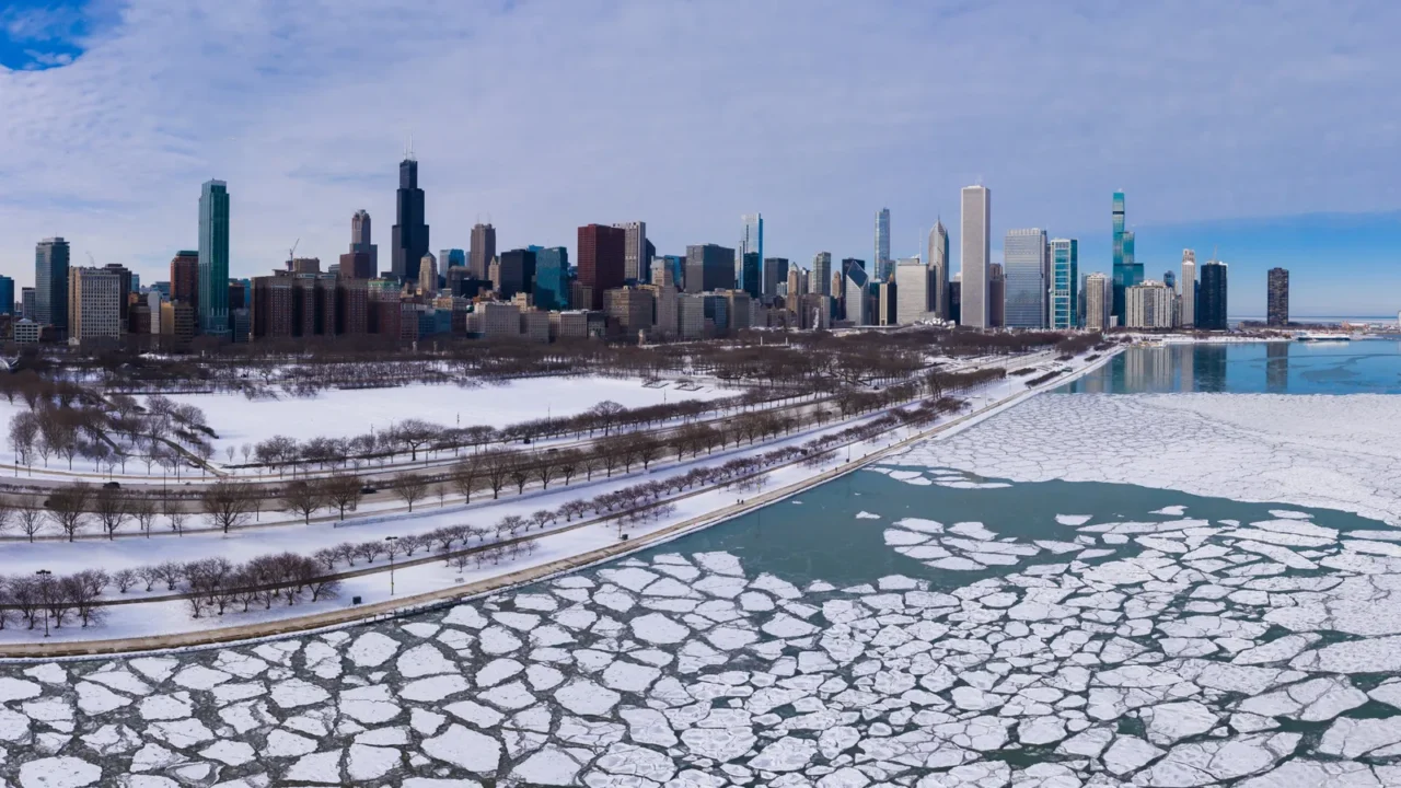 urban skyline of chicago loop and frozen lake michigan with