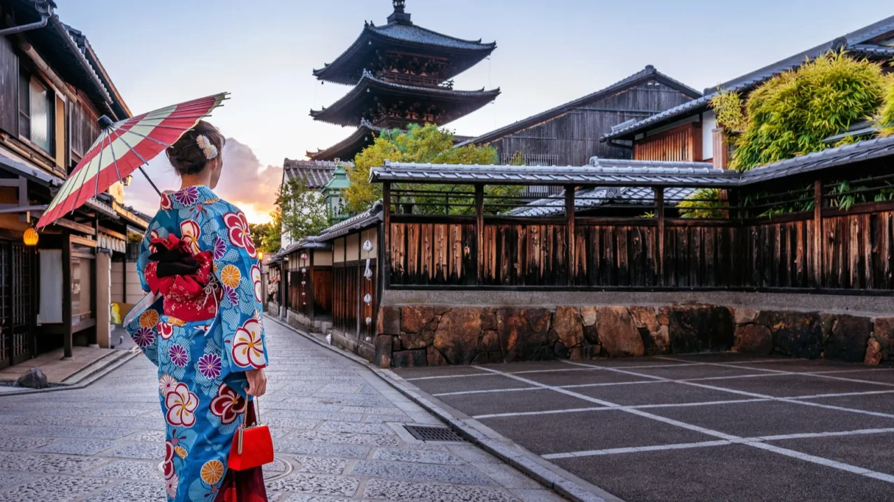 woman wearing japanese traditional kimono with umbrella at yasaka pagoda
