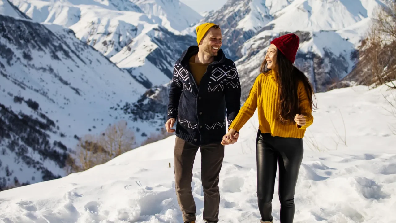 young couple in love enjoying on winter vacation together on