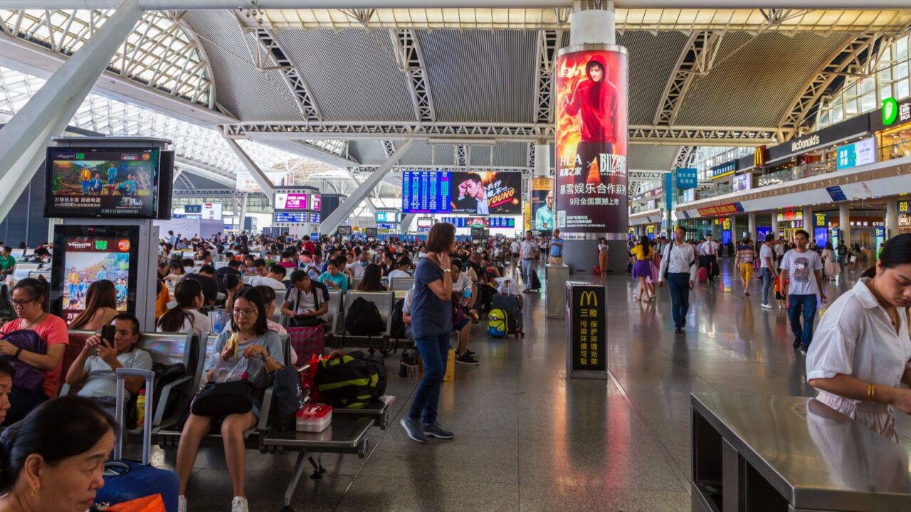 Guangzhou, China -September 16, 2019:Crowed passengers on Guangzhou South Railway Station (Guangzhounan, Shibi Station). Transportation hub for high-speed trains.(Image Slightly motion blur and noise)