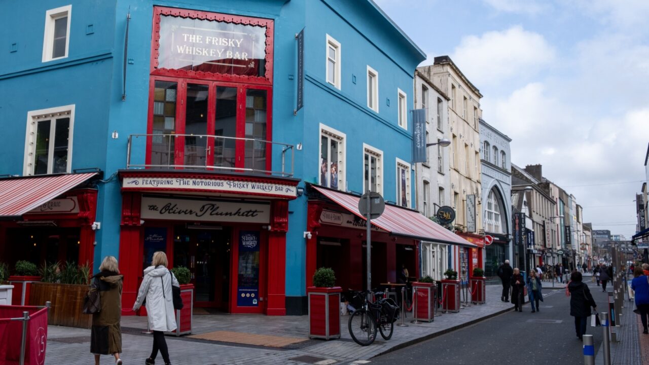 Cork, Ireland, March 29 2023: St princess shopping street with retail and department stores on a cloudy day. Cork Ireland Europe