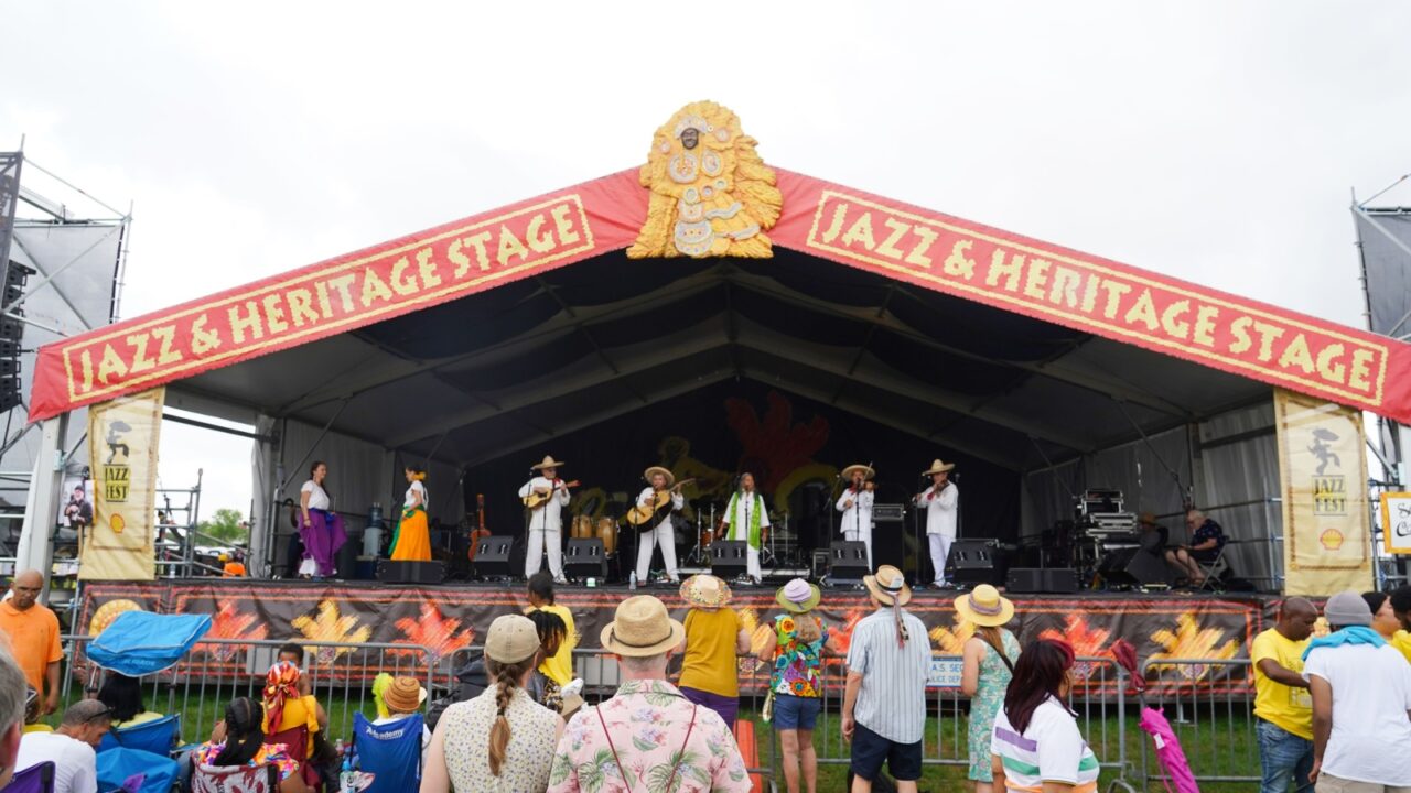 New Orleans, Louisiana - April 24, 2025: Fans watch a Mexican band on the Jazz and Heritage Stage at the 2025 New Orleans Jazz and Heritage Festival.