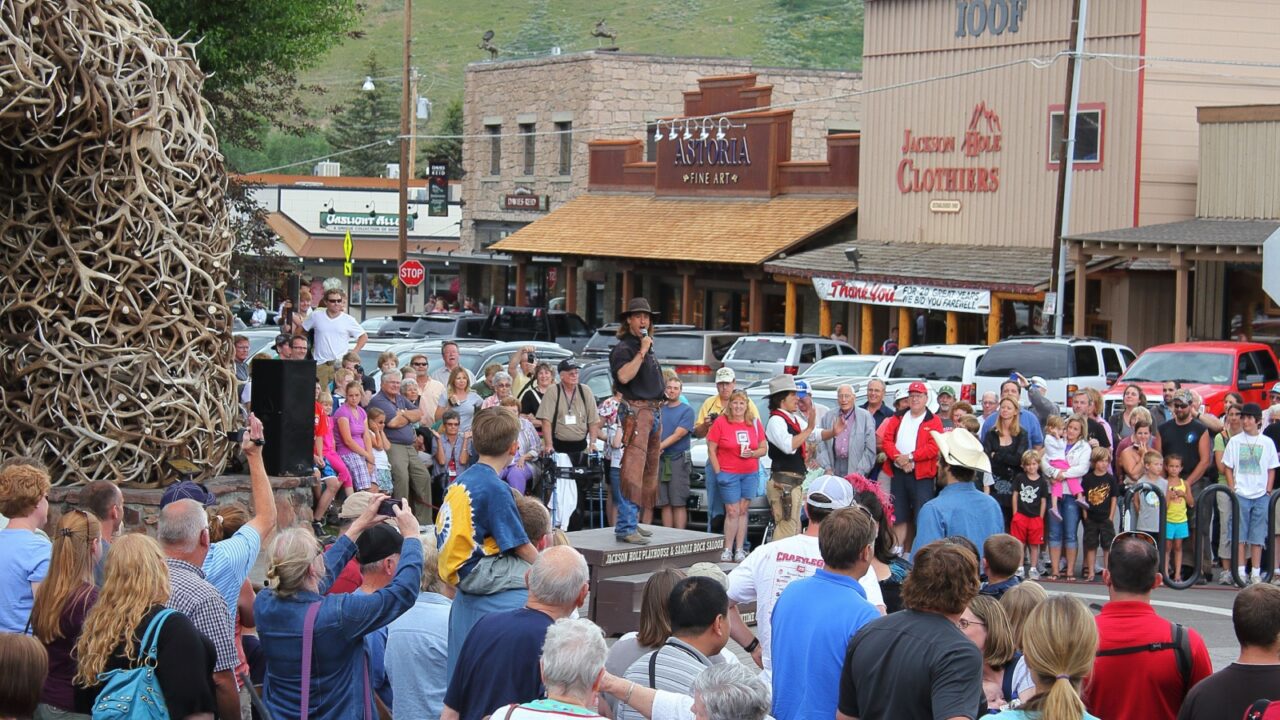 Jackson Hole, Wyoming / USA - 07/19/2011: Wild west shootout show in the downtown streets by the Jackson Hole Playhouse and Saddle Rock Saloon with cowboys, cowgirls and bandits shooting Colt .45