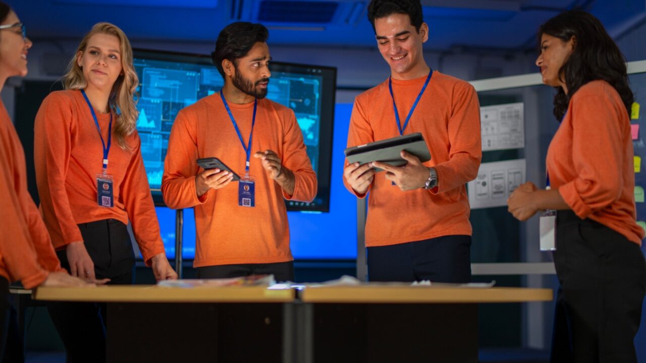 Group of employees are brainstorming for create mobile application. Technology, mobile application, teamwork.