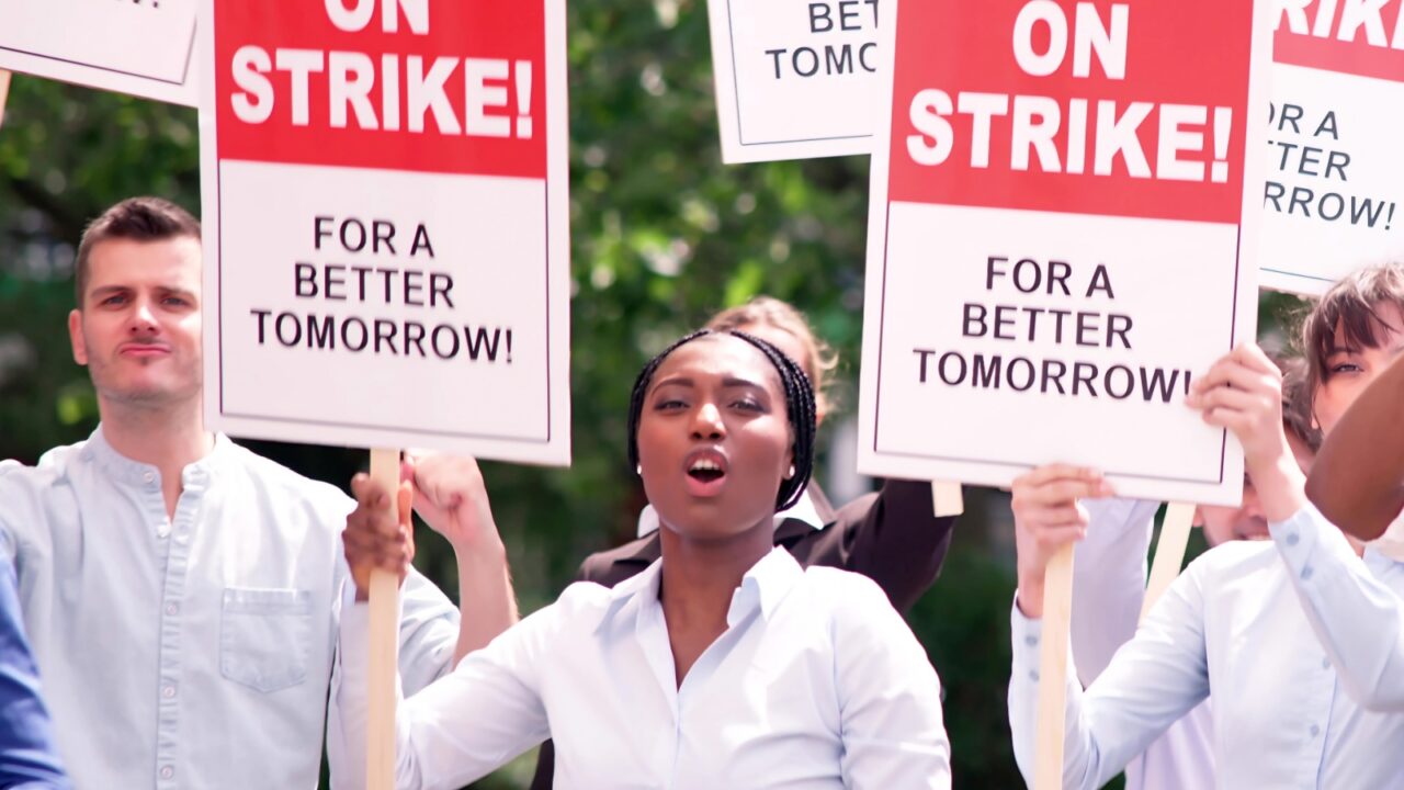 Union workers in city demonstrate power during labor strike.