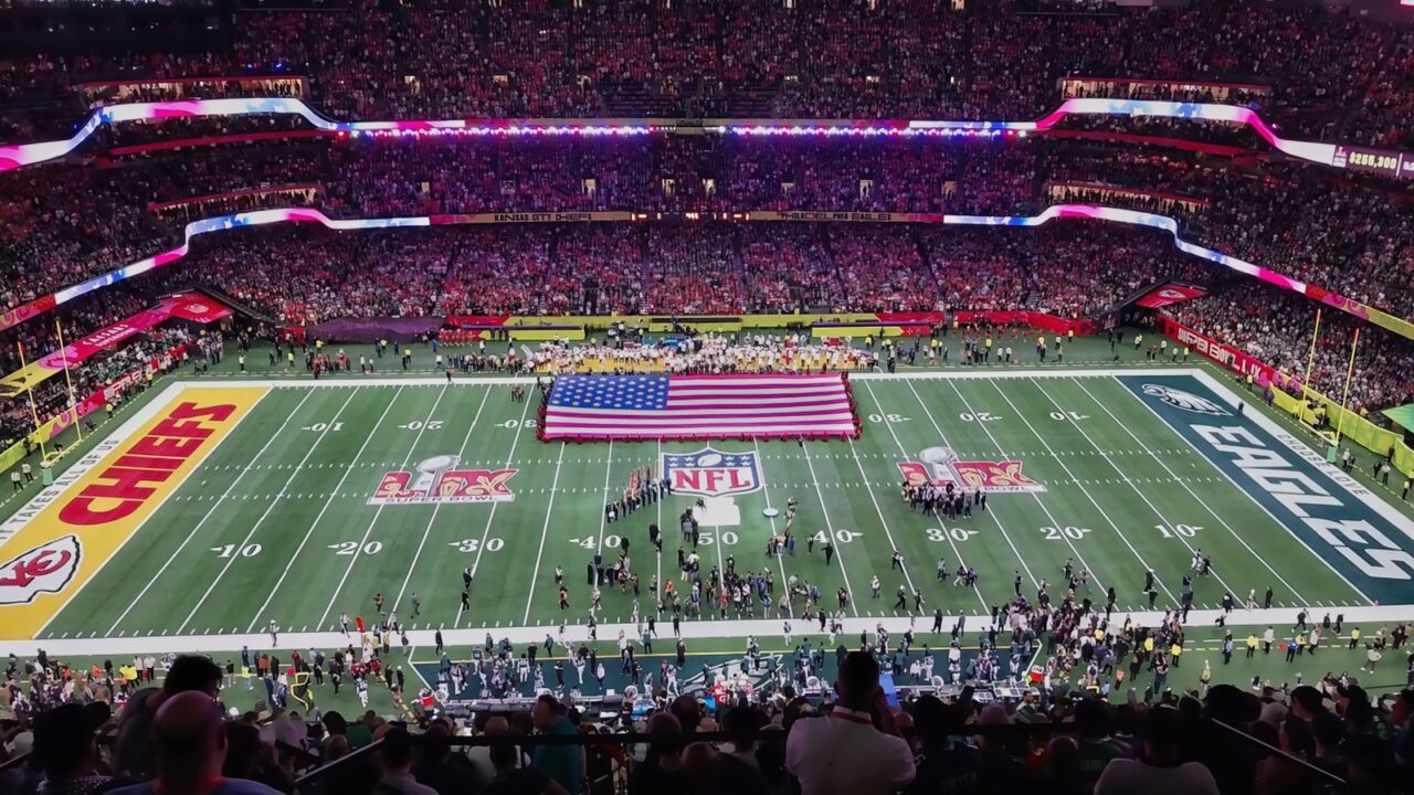 The American flag is displayed at Super Bowl LIX