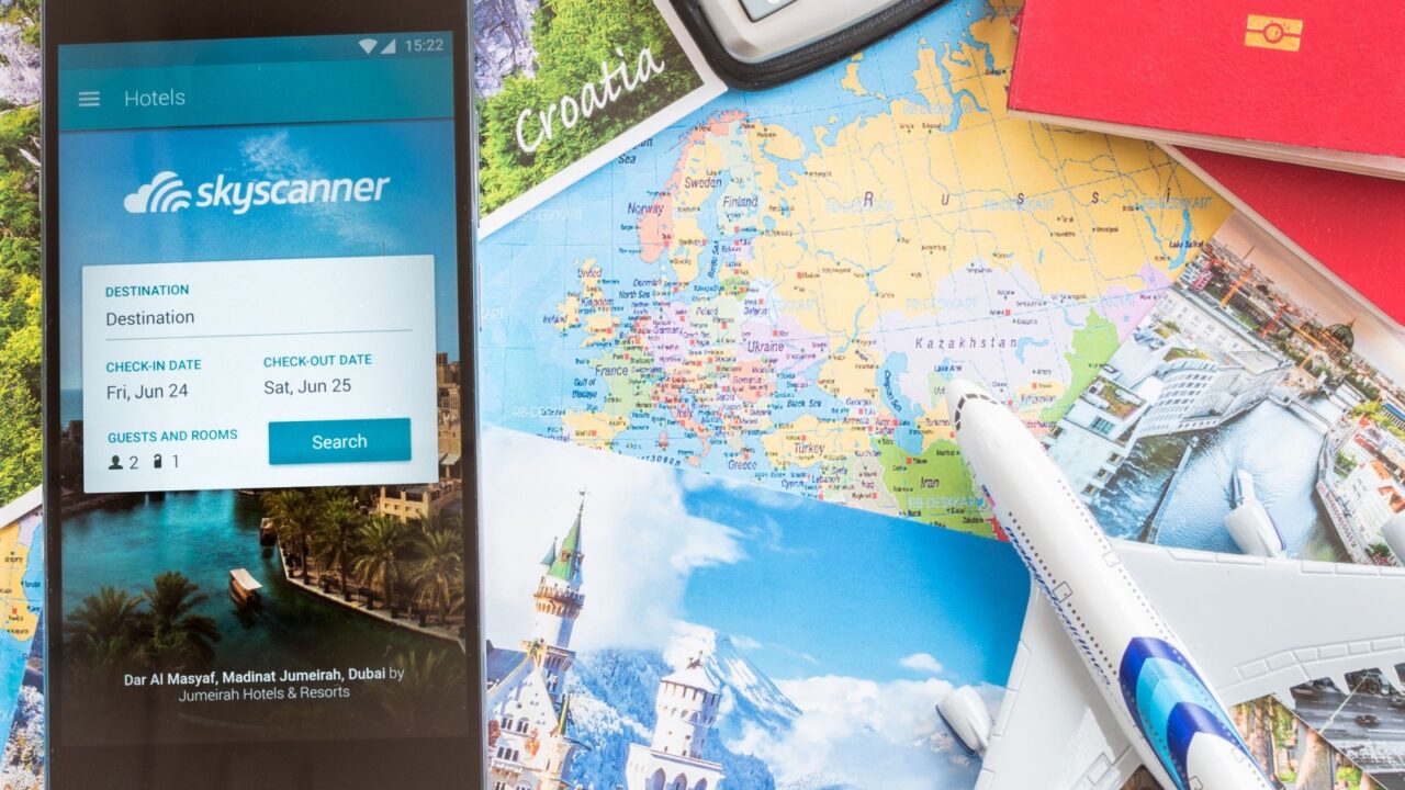 MANCHESTER, UNITED KINGDOM -27 JUNE 2016: Mobile apps make traveling so much easier. Search, compare and book cheap flights on the go with the award-winning Skyscanner Flights app!