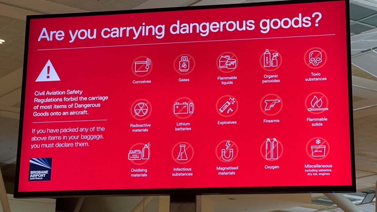 BRISBANE - JAN 29 2025:Are you carrying dangerous good? sign at Brisbane Airport. Dangerous goods can be harmful on an aircraft, flammable, explosive, toxic, or react dangerously with other substances