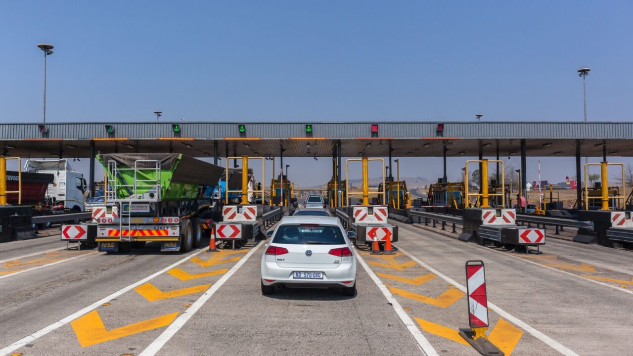 Road Highway Vehicles Toll Gates Highway Tolls, South-Africa - Sept 15 2017: Drivers View traveling road highway toll gate booths vehicle route on N3 at Mooi-River KZ-Natal South-Africa.