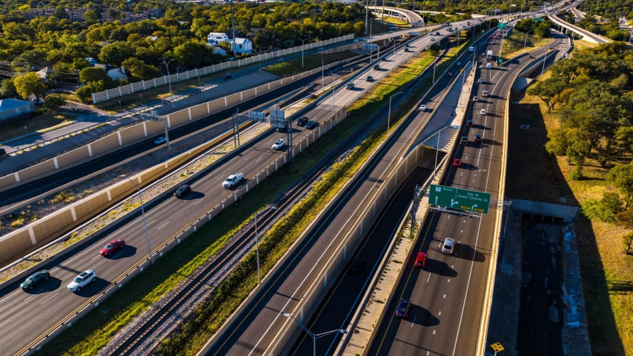 Transportation Highway aerial drone sunrise over busy road way in Austin , Texas , USA