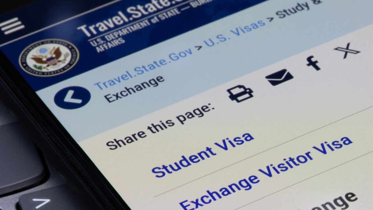 Portland, OR, USA - May 30, 2025: The U.S. Department of State's student and exchange visas page is seen on its official website on the screen of a smartphone.