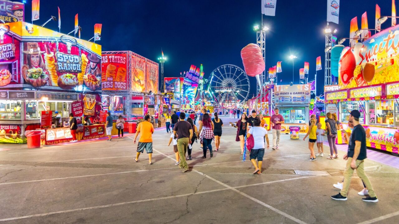 Phoenix, Arizona - October 25, 2017: People throng the midway at the Arizona State Fair during the evening hours.