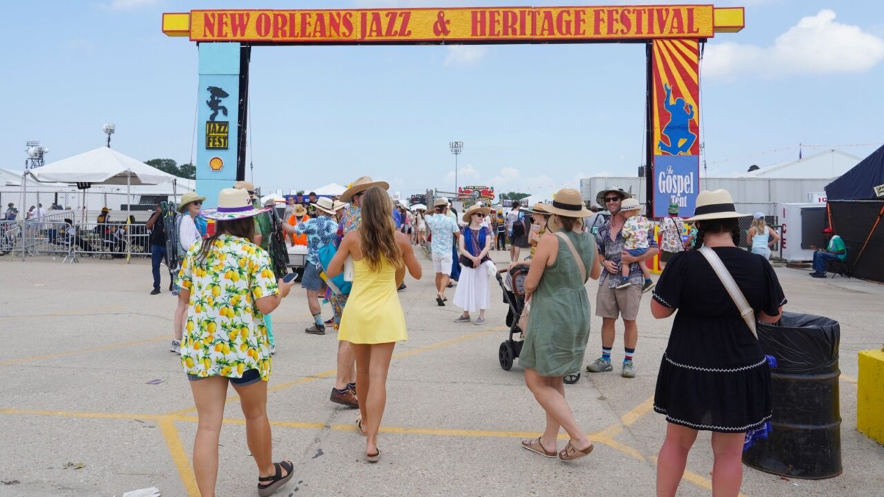 New Orleans, Louisiana - April 27, 2025: Fans walk into the 2025 New Orleans Jazz and Heritage Festival presented by Shell.