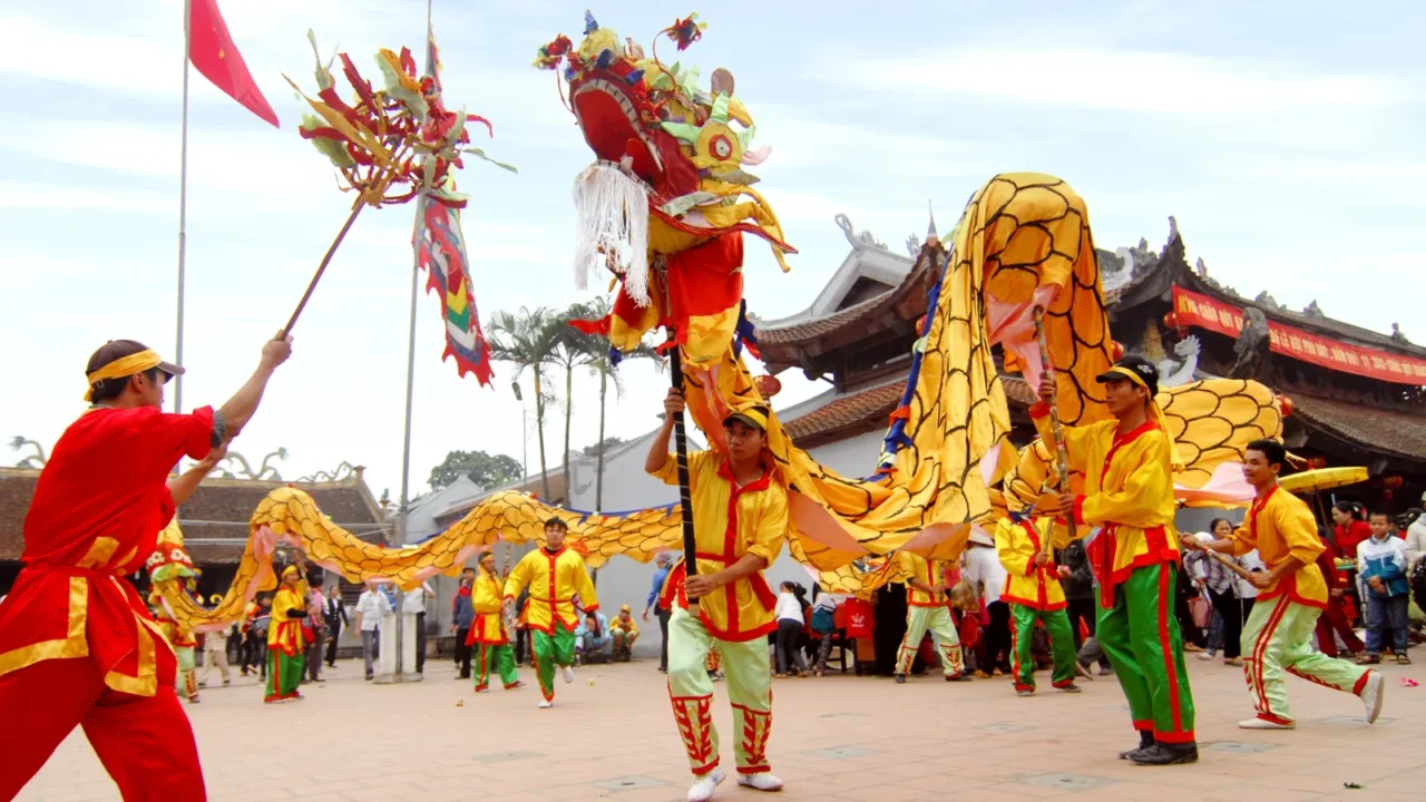 a group of unidentified dancer with their colorful dragon on