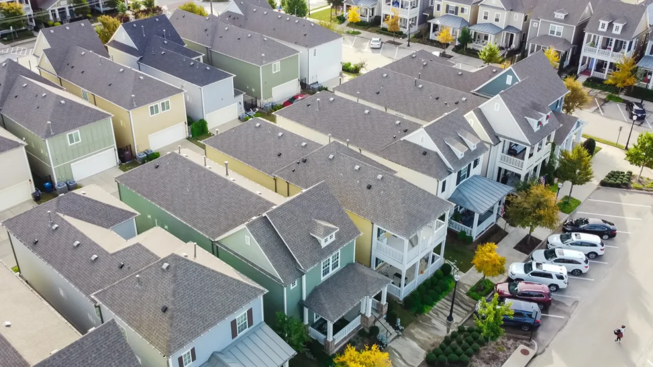 aerial view closeup roof shingles of new development townhouse near