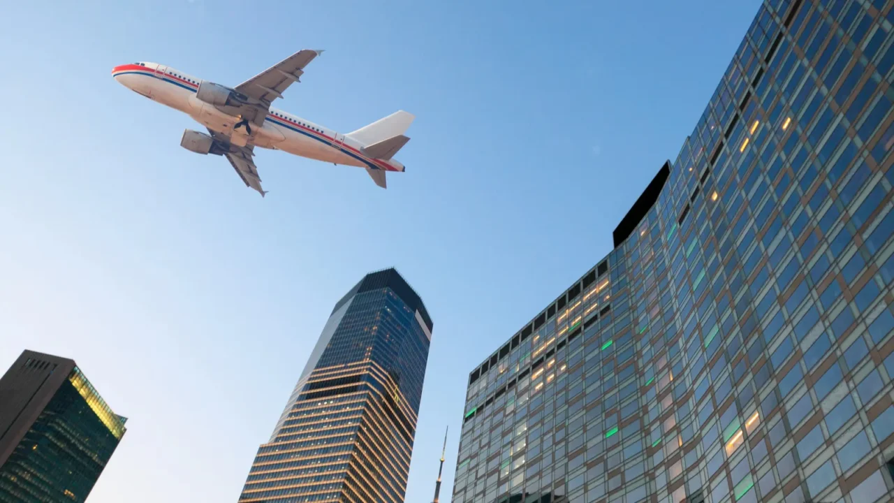airplane on the modern city