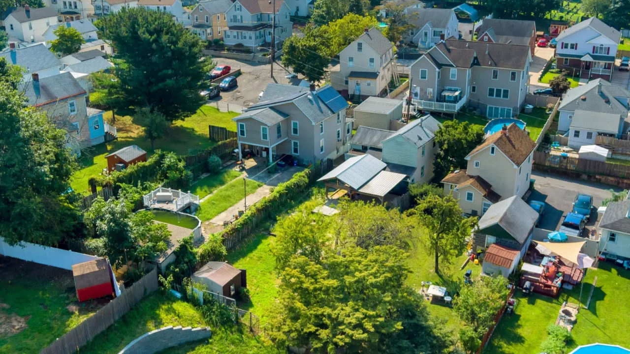 american town suburban neighborhood features homes backyards above ground pool