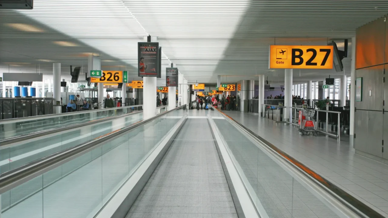amsterdam april 14 passengers move around the terminal at