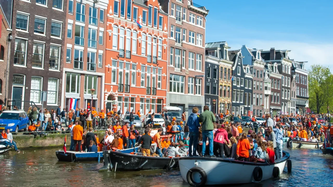 amsterdamapril 27 people on the boats participate in celebrating kings