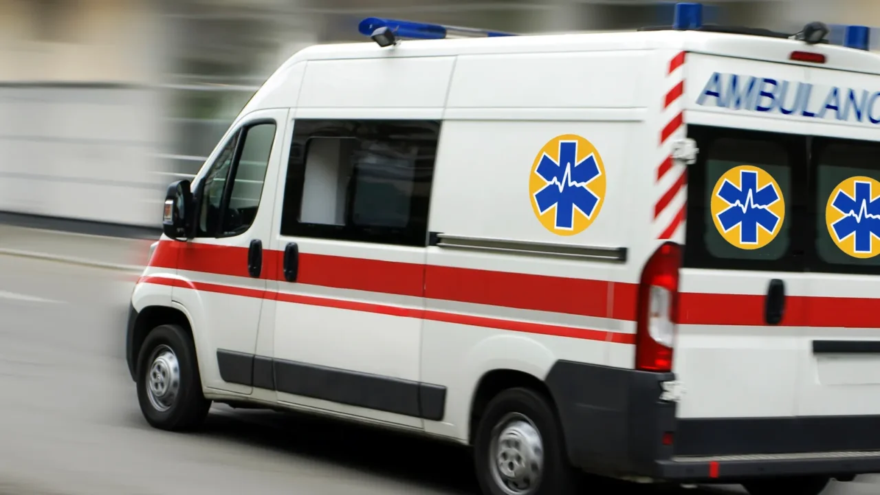 an ambulance is driving down the street