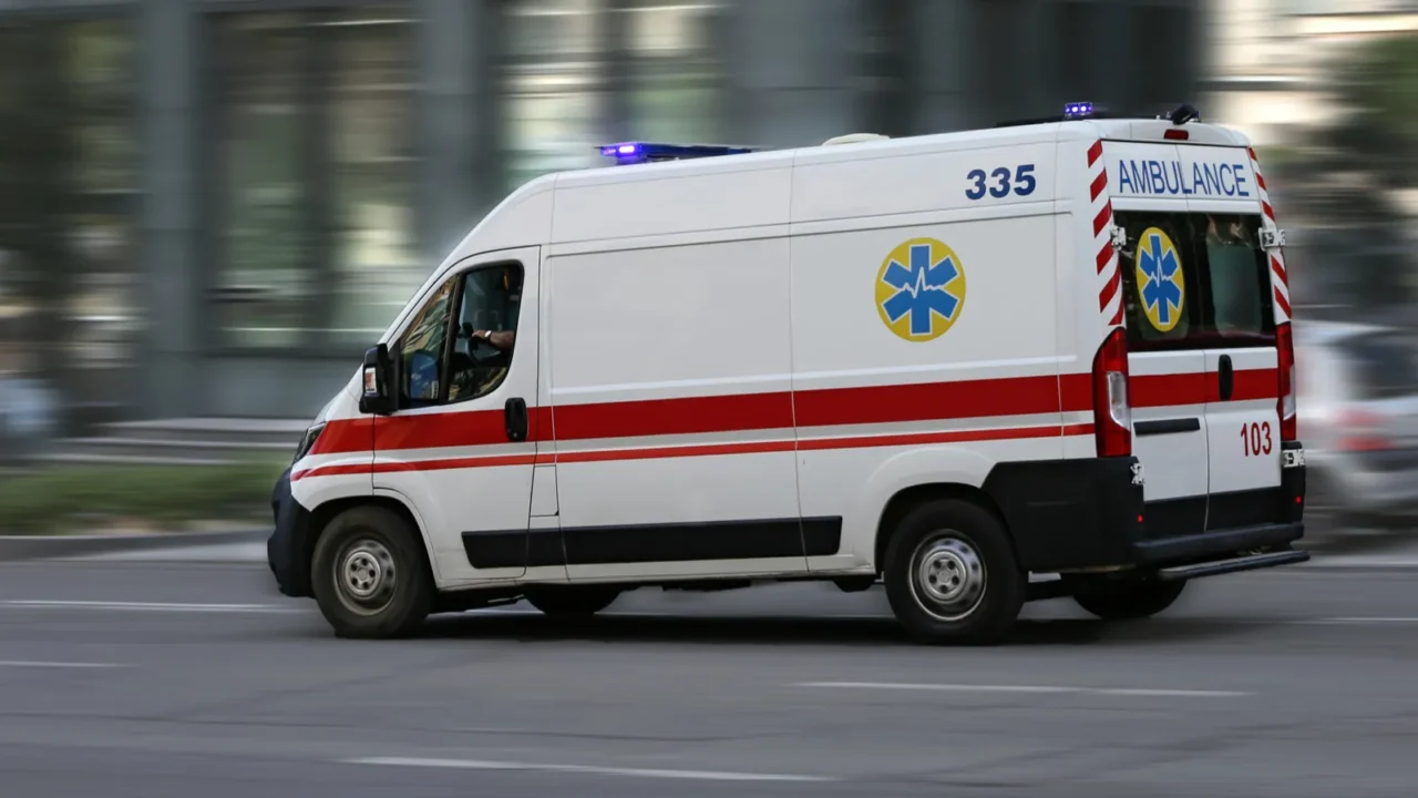 an ambulance is driving down the street