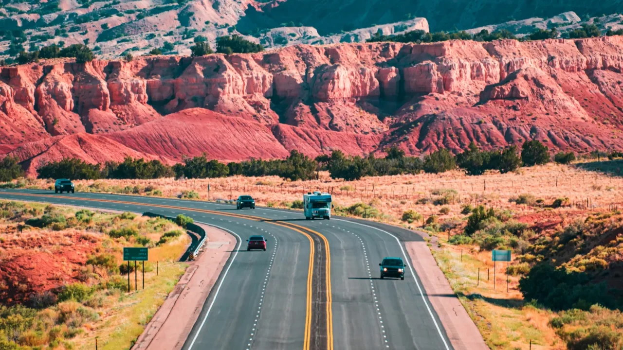 asphalt highway and hill landscape under the blue sky curved