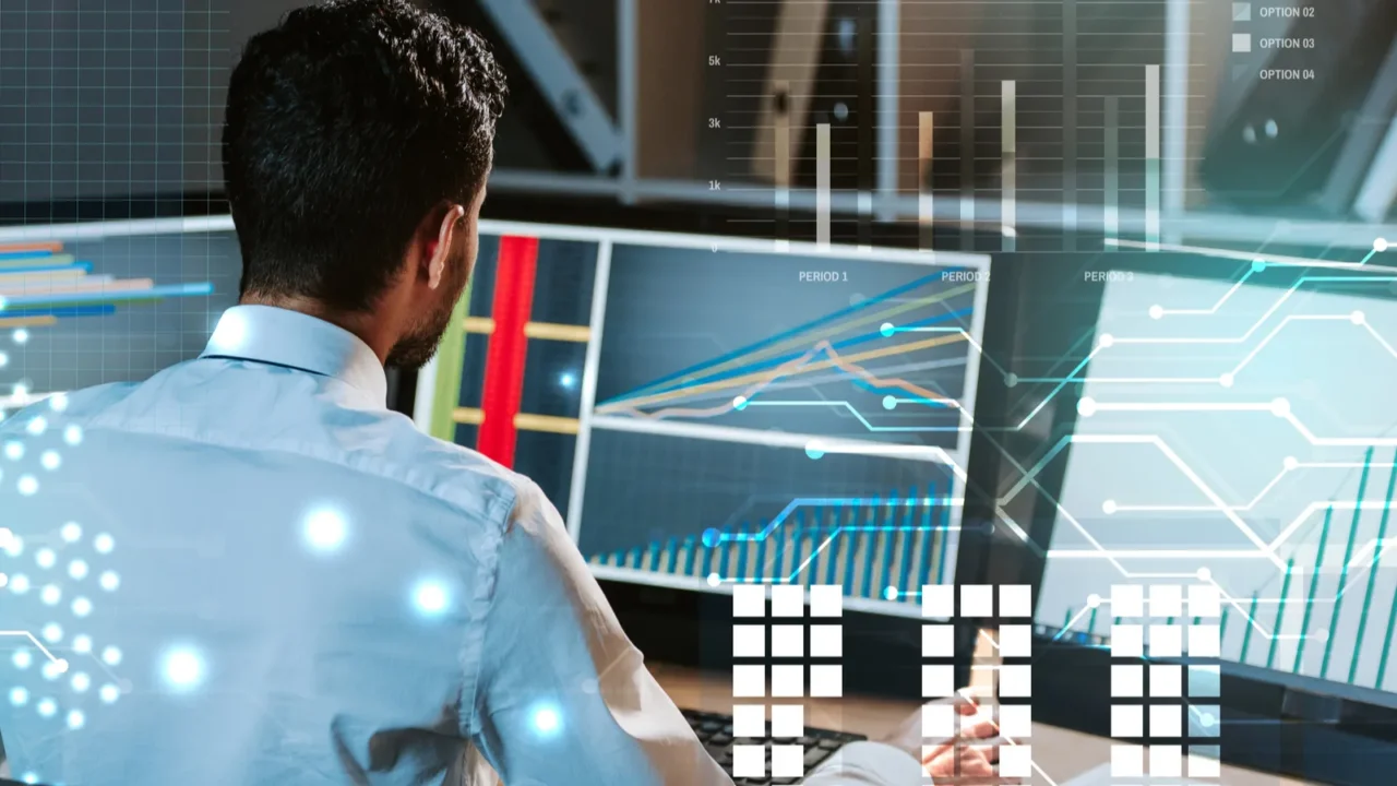 back view of trader working near computer with graphs
