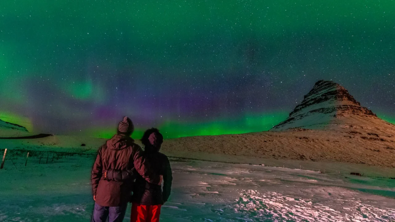 beautiful northern lights with kirkjufell on the background iceland