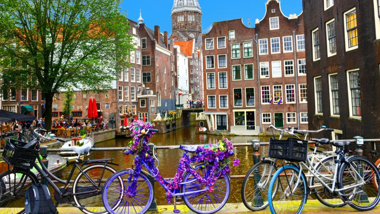 bicycles over canal amsterdam city picturesque landscape in the nitherlands