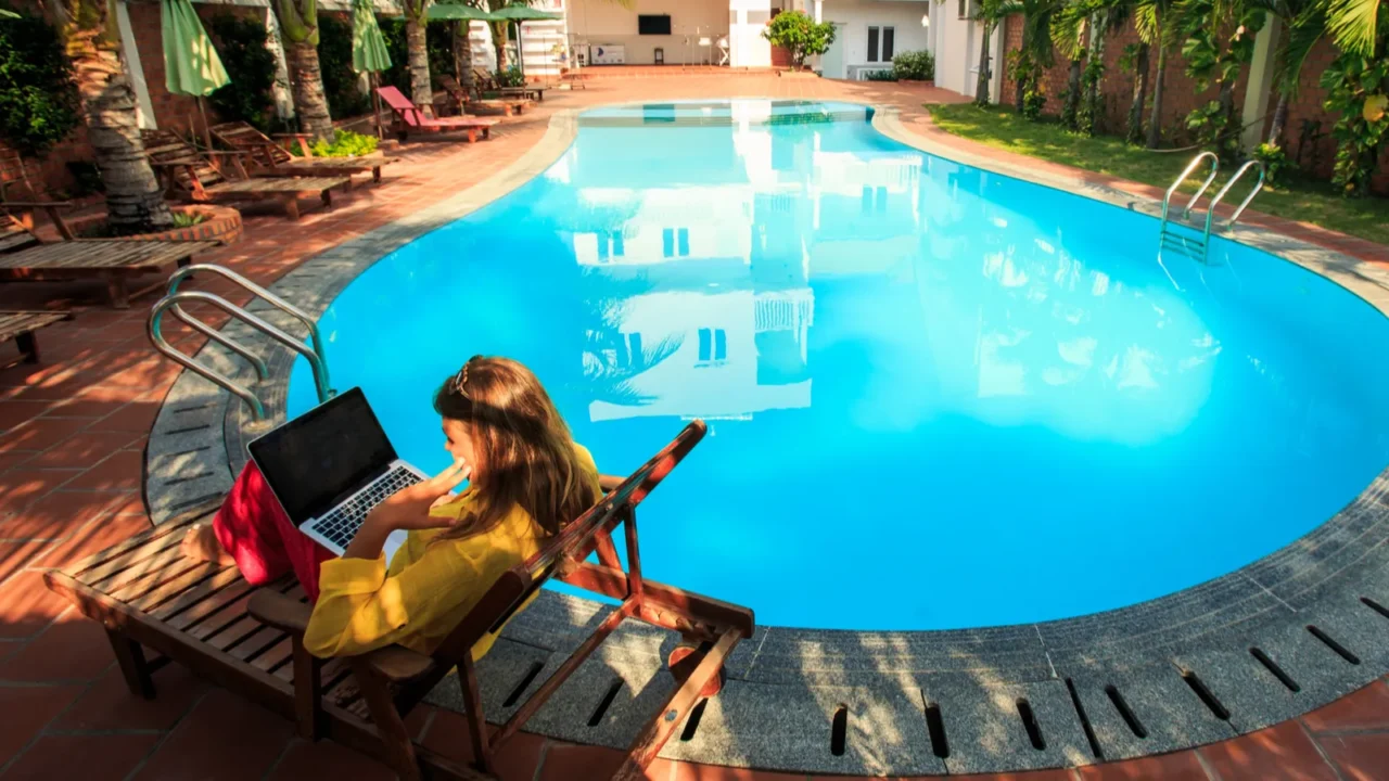 blonde girl dressed in long sleeves blouse sits in folding