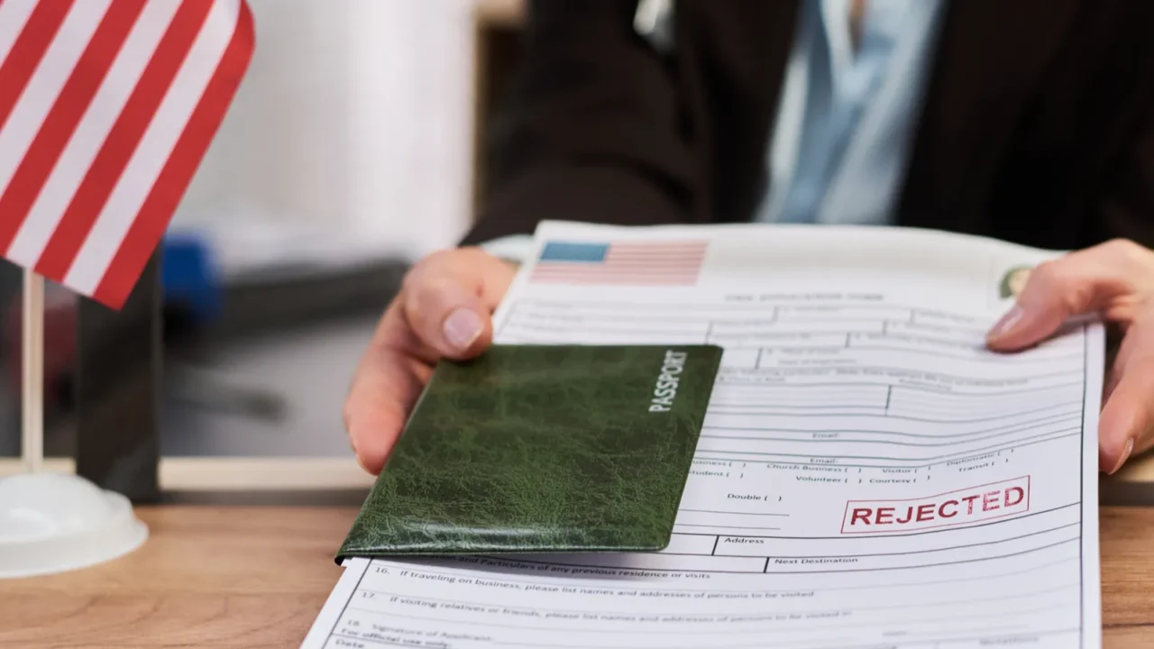 caucasian middle aged woman handing over passport and visa application