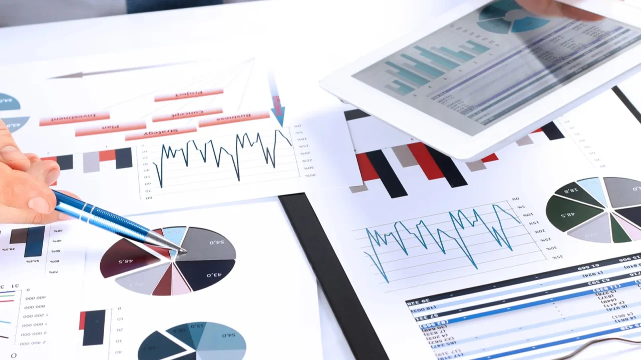 closeup of businessman analyzing graphs on a digital tablet