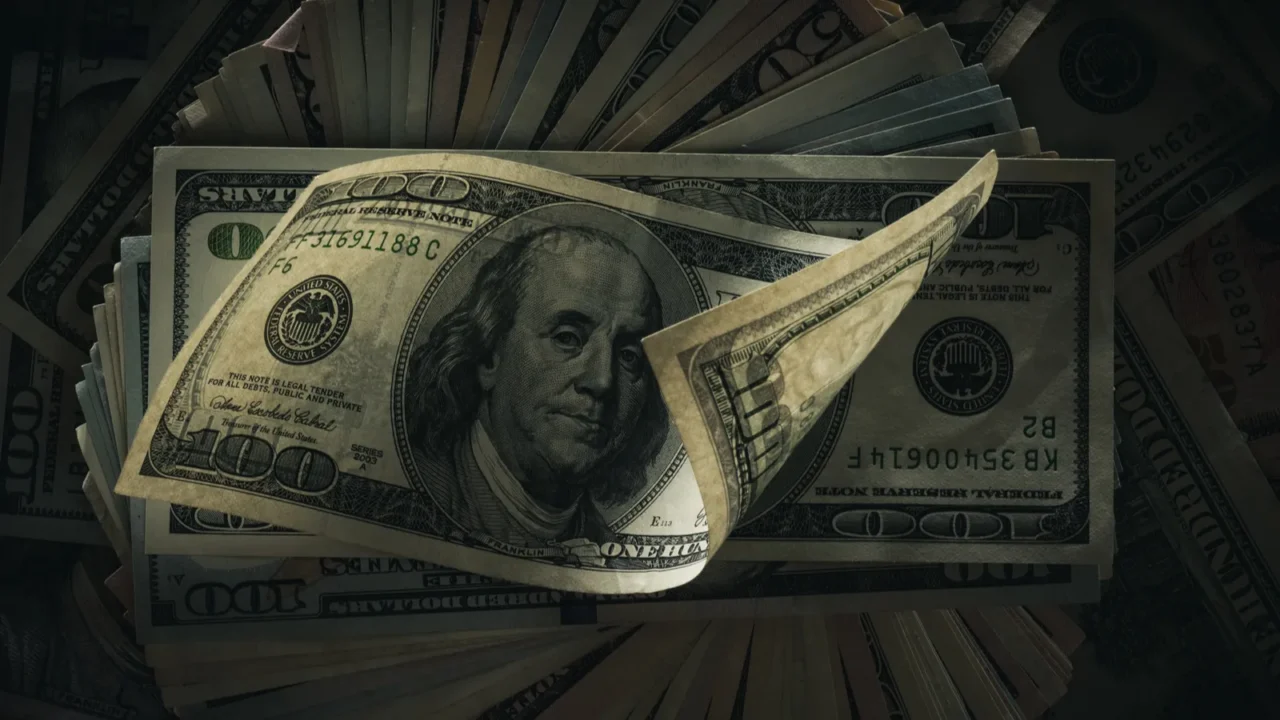 dollar banknotes on dark
