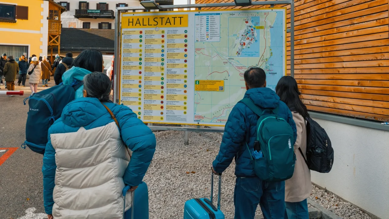 hallstattaustrianovember 18 2025 a group of visitors studies a detailed