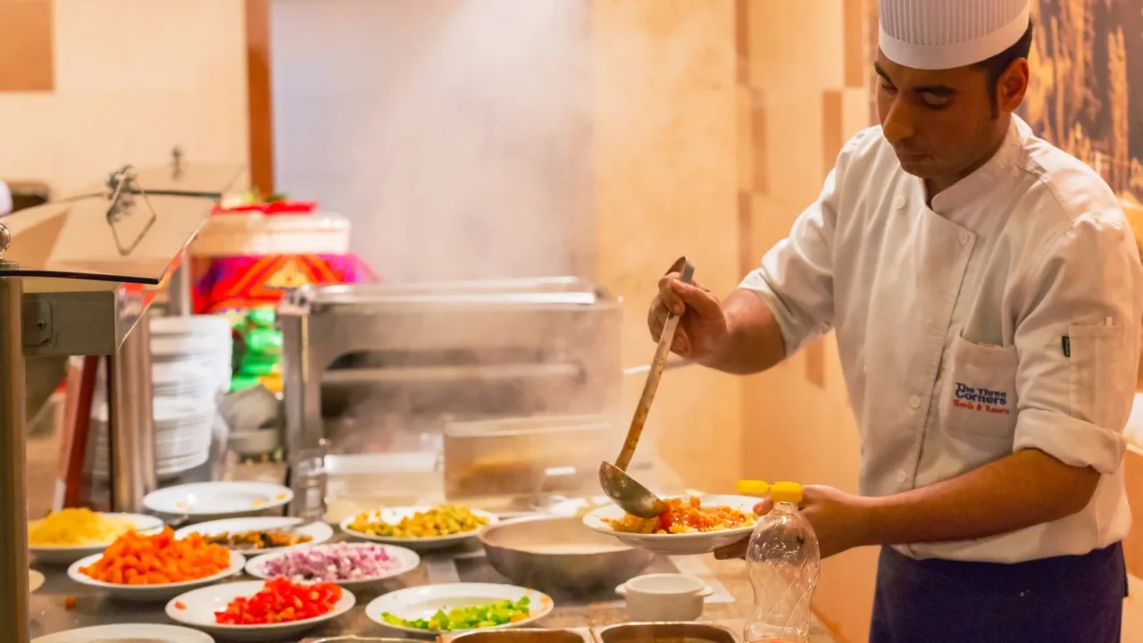 hurghada egypt  apr 9 2013 cook serving dinner at