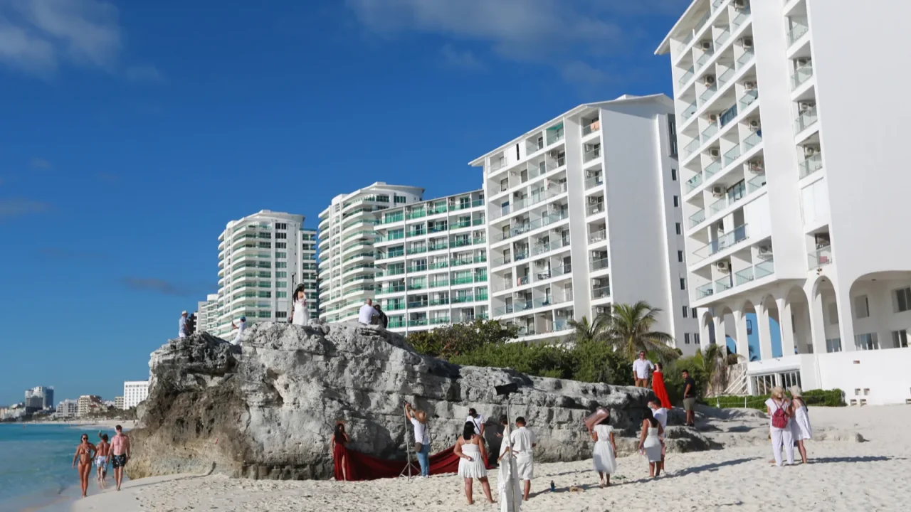 image of a beach photo shoot taking place at playa