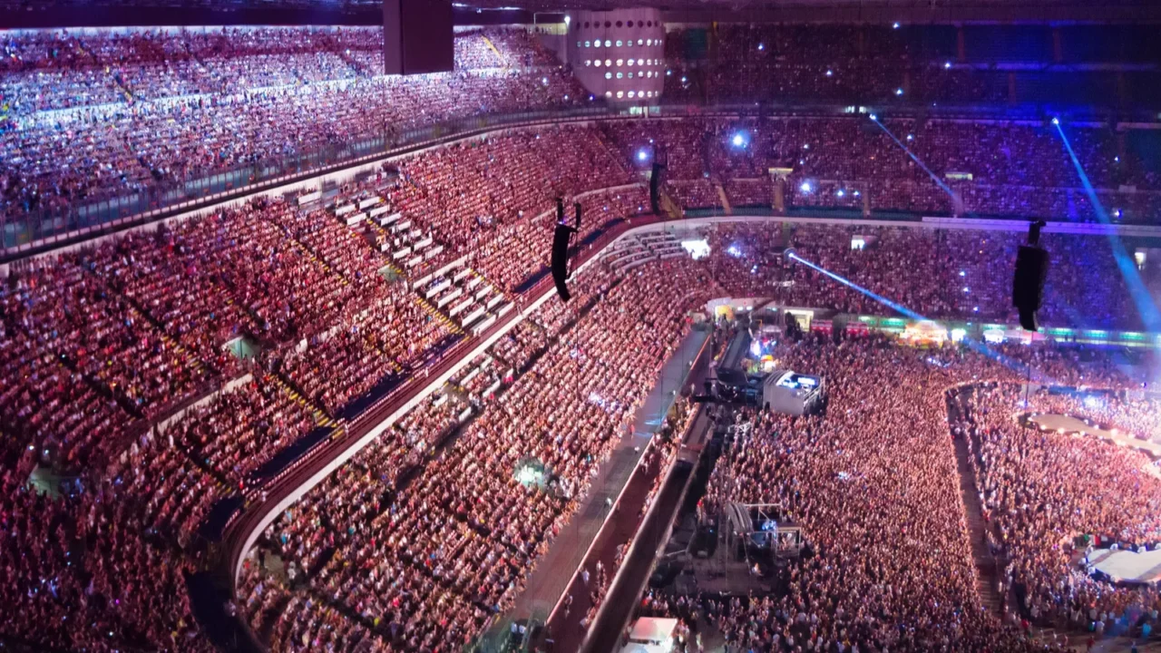 large crowd of people watching concert